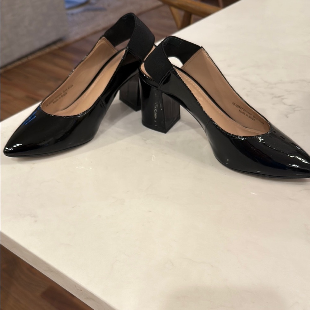 Gently worn Johnston & Murphy patent along back block heel shoes.